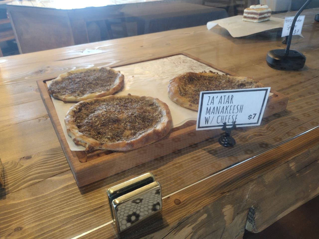 Fresh za'atar manakeesh on a wooden board