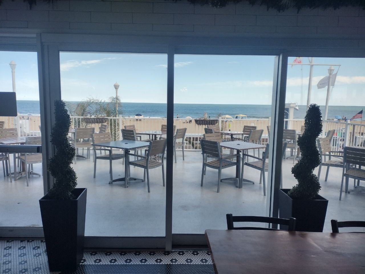 Glass doors opening onto the beach at bai-tee